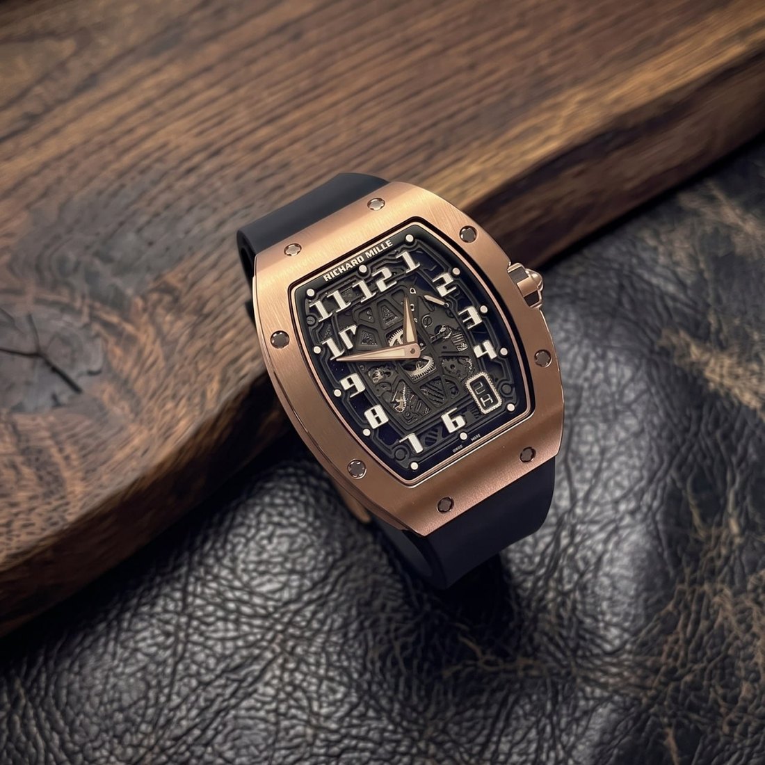 Richard Mille RM 67-01 in rose gold on a dark leather background